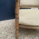 Pair of wooden and cream fabric armchairs