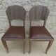 Two restyled leather-style chairs with nails