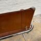 Vintage aluminum tube and tan leather armchair
