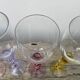 4 large, multicoloured, twisted champagne flutes