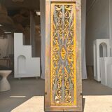 Rectangular Indonesian construction element with blue and yellow plant in carved wood