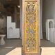 Rectangular Indonesian construction element with blue and yellow plant in carved wood