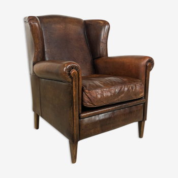 Dark brown sheep leather wingback armchair