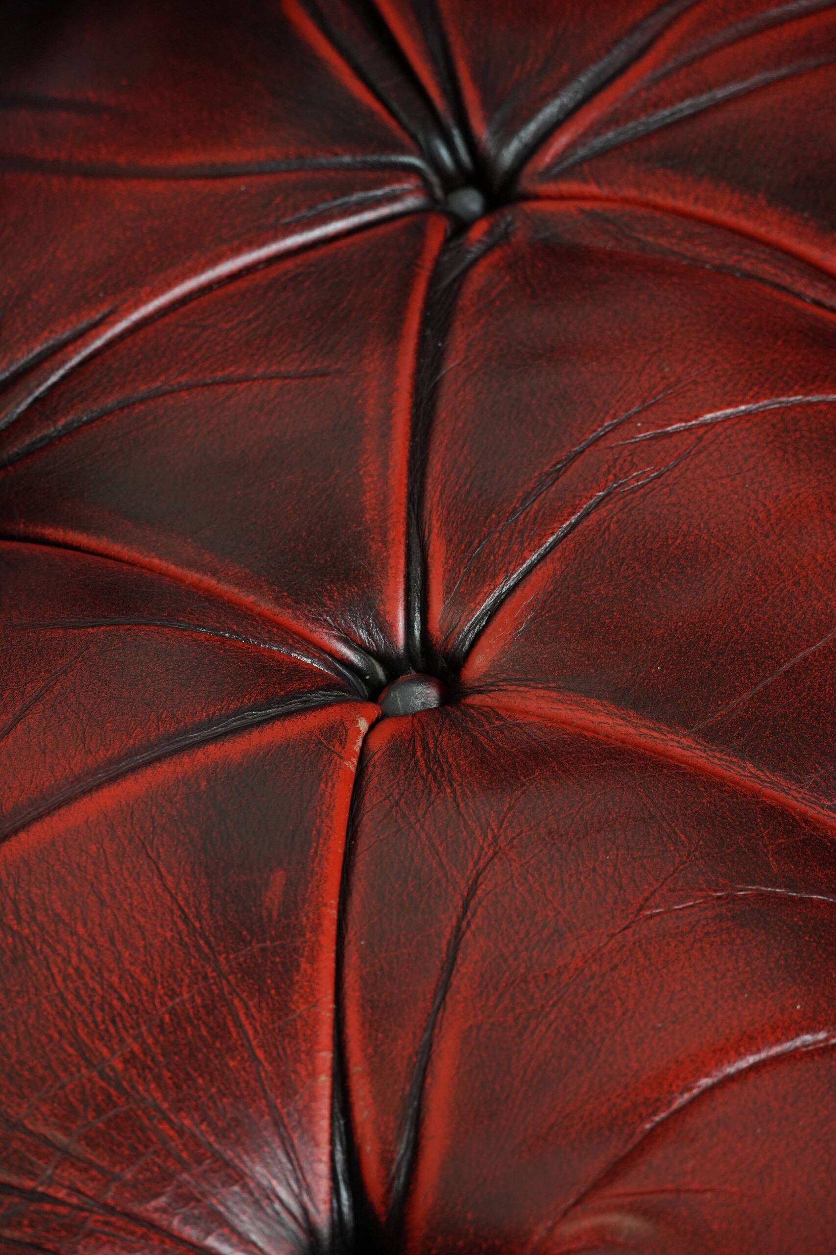 Classic cowhide Chesterfield button seat armchair in a beautiful red colour