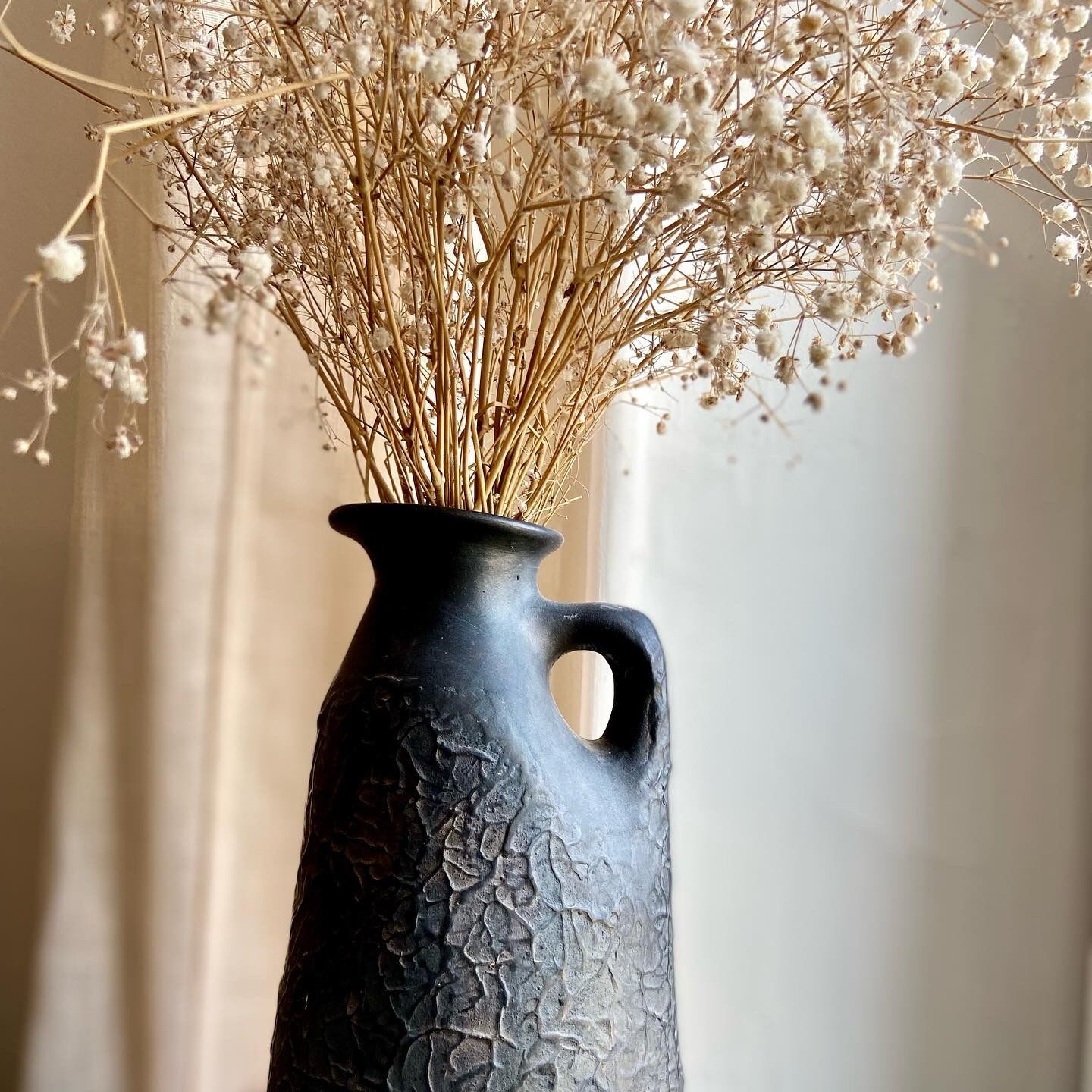 Black ceramic pitcher from the 50s