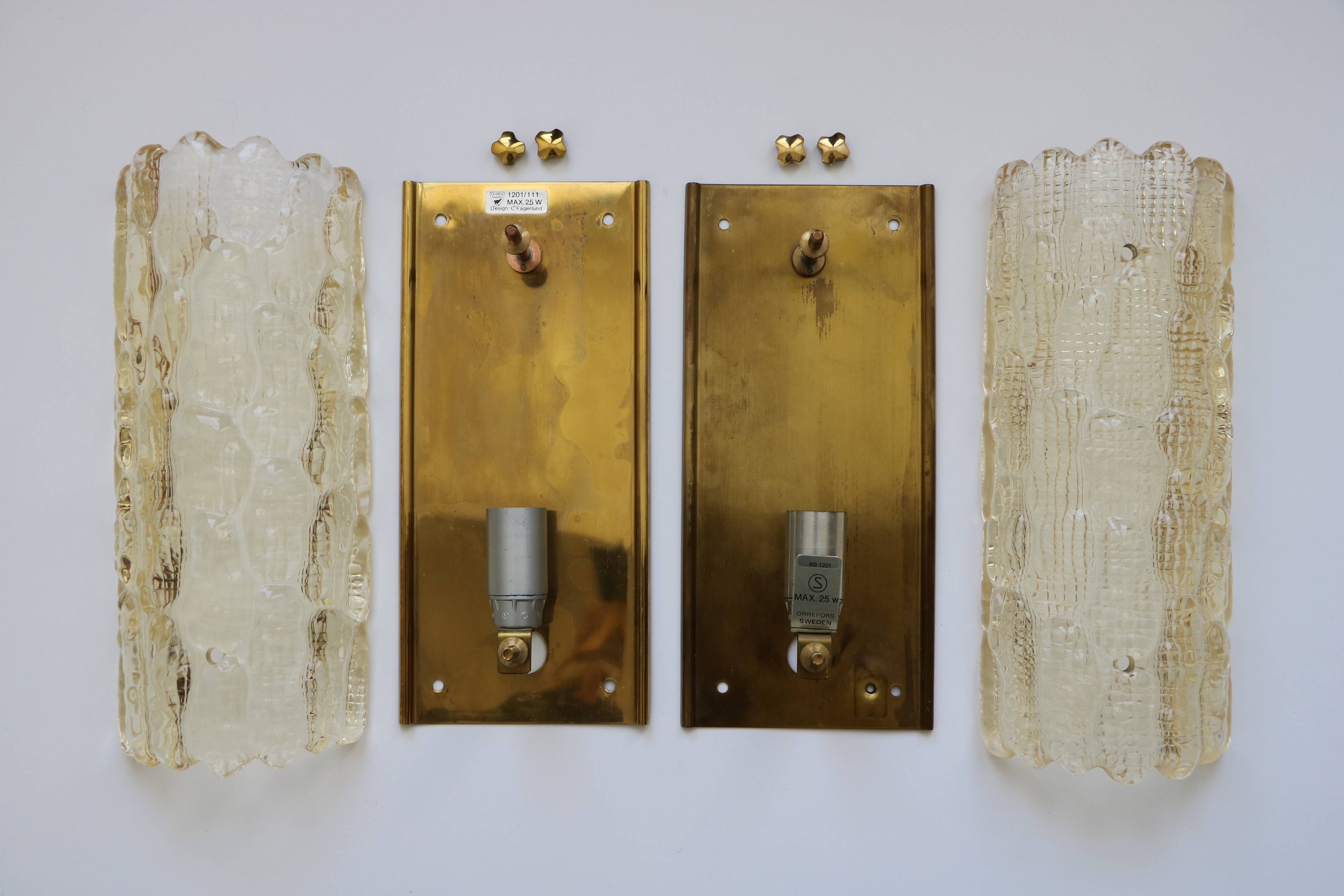 Pair of glass and brass wall lights by Carl Fagerlund for Orrefors, 1960.