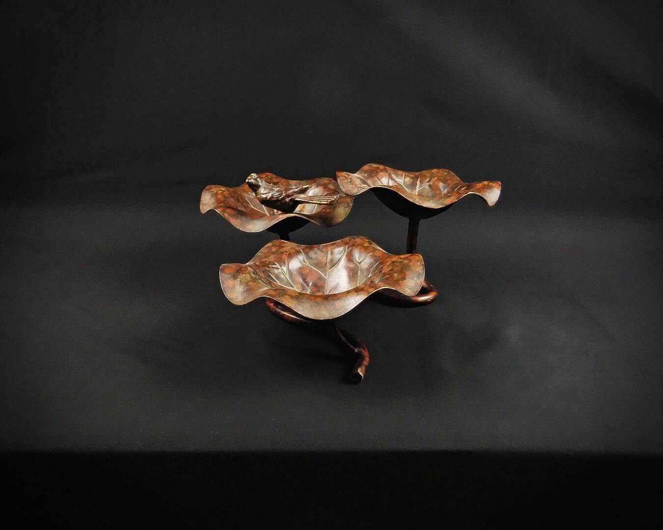 Three-tiered lotus leaf shaped patinated metal bird bath