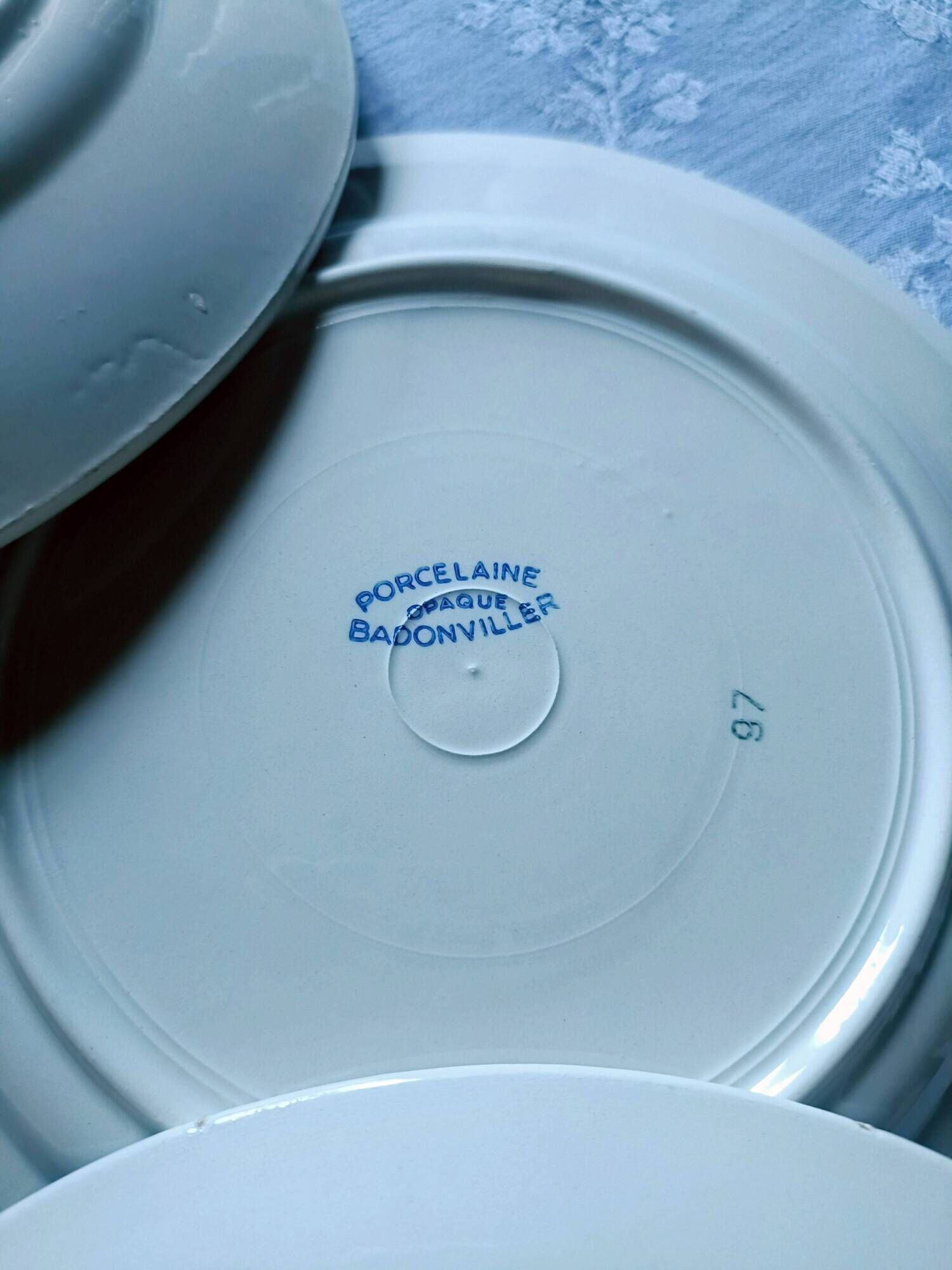 Five numbered opaque porcelain plates from Badonviller.