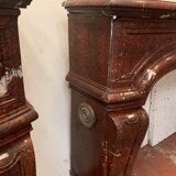 Pair of Louis XIV style fireplaces in red cherry marble. XIX century.