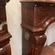Pair of Louis XIV style fireplaces in red cherry marble. XIX century.
