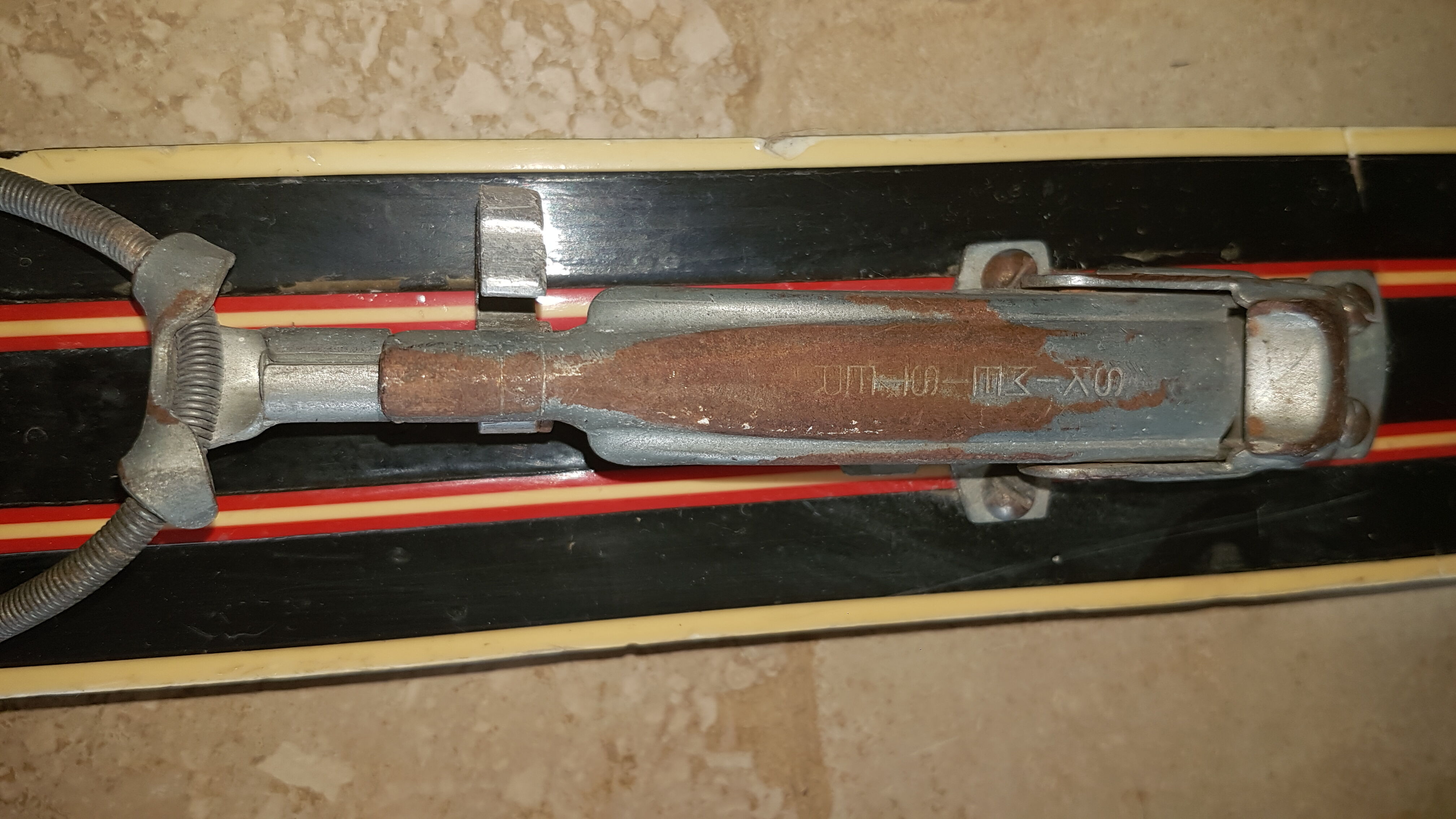Old skis wooden and its pair of sticks