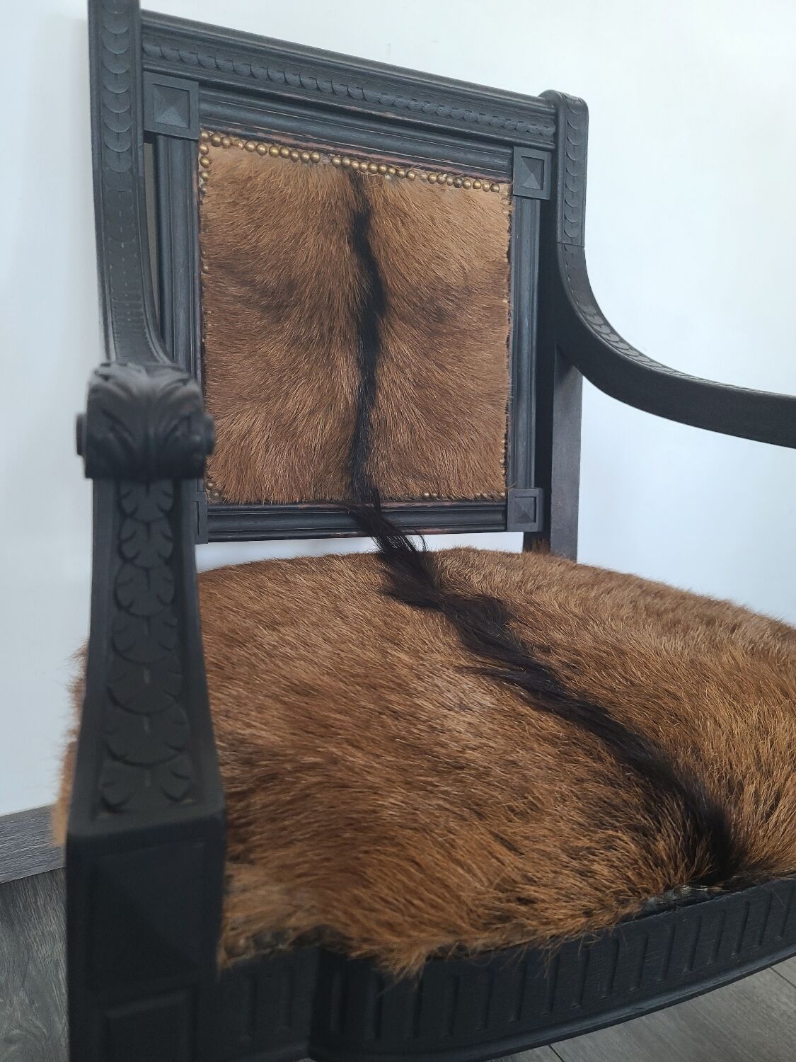 Character armchair in black wood and animal skin #CHMR