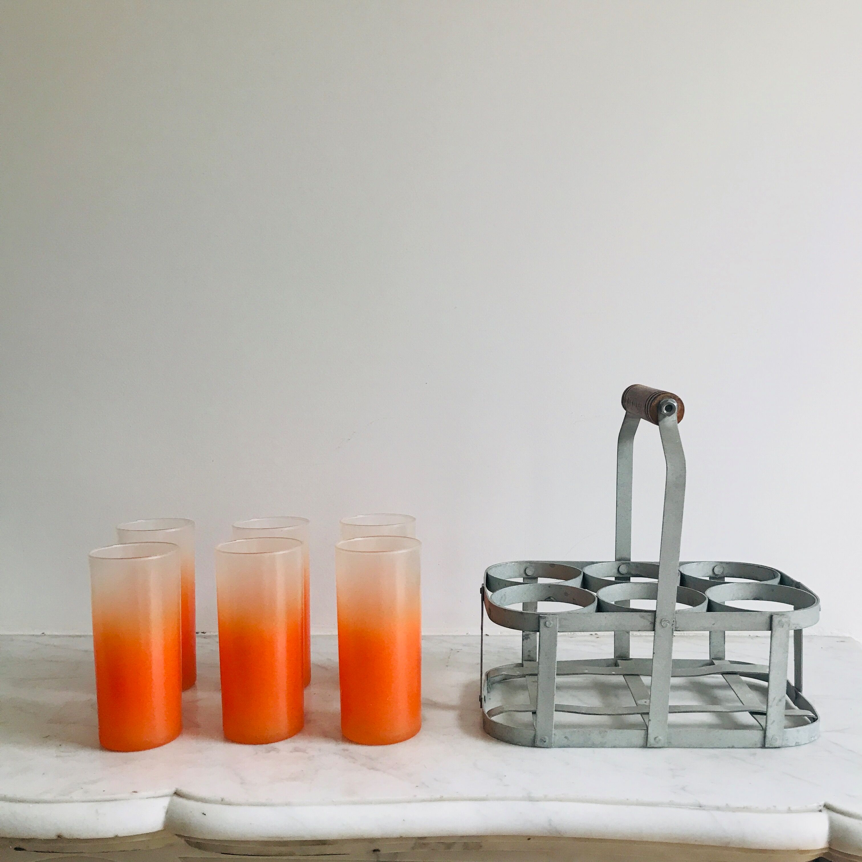 6 orangeades glasses in their basket
