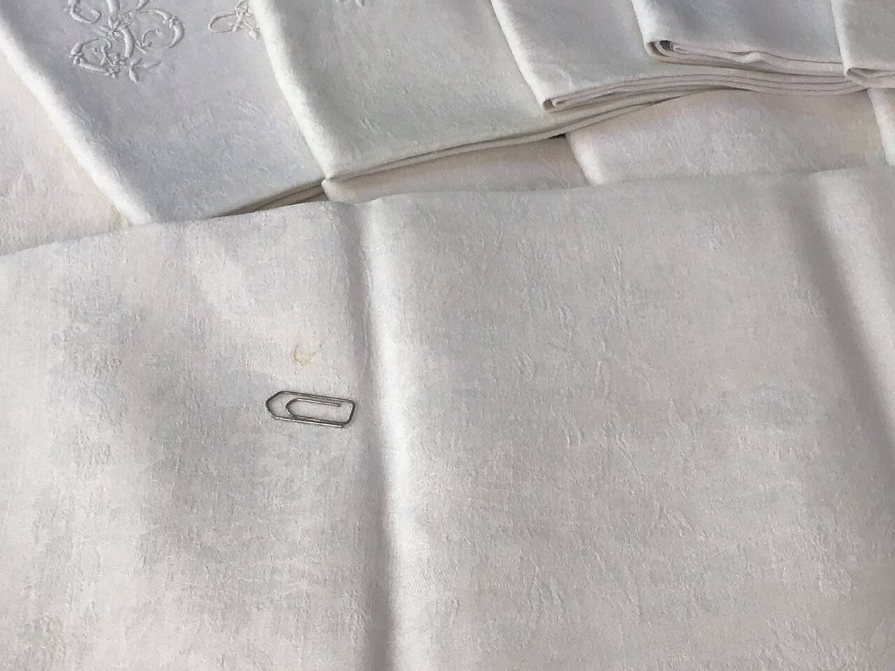 Set of 12 19th century white napkins marked “BL”