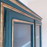 Glass cabinet in green patinated wood