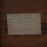 Vintage Indian teak coffee table inlaid with elephant motifs, mid-20th century.