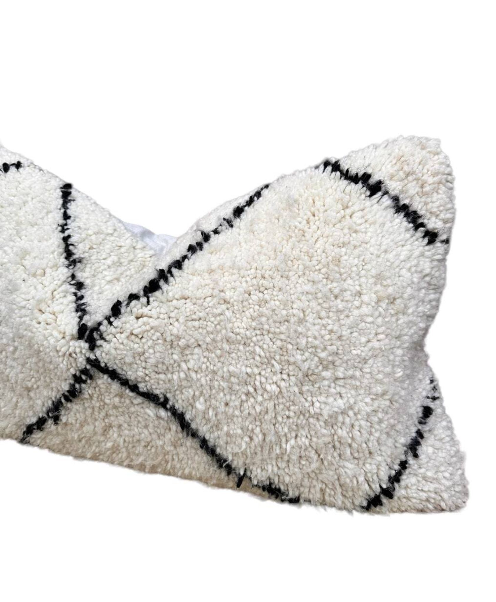 Bohemian wool pillow cover on a Beni Ourain Berber cushion. The cushion cover