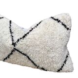 Bohemian wool pillow cover on a Beni Ourain Berber cushion. The cushion cover