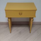 Old bedside table with compass feet