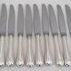 Christofle Spatours, 12 silver-plated table knives, in excellent condition.