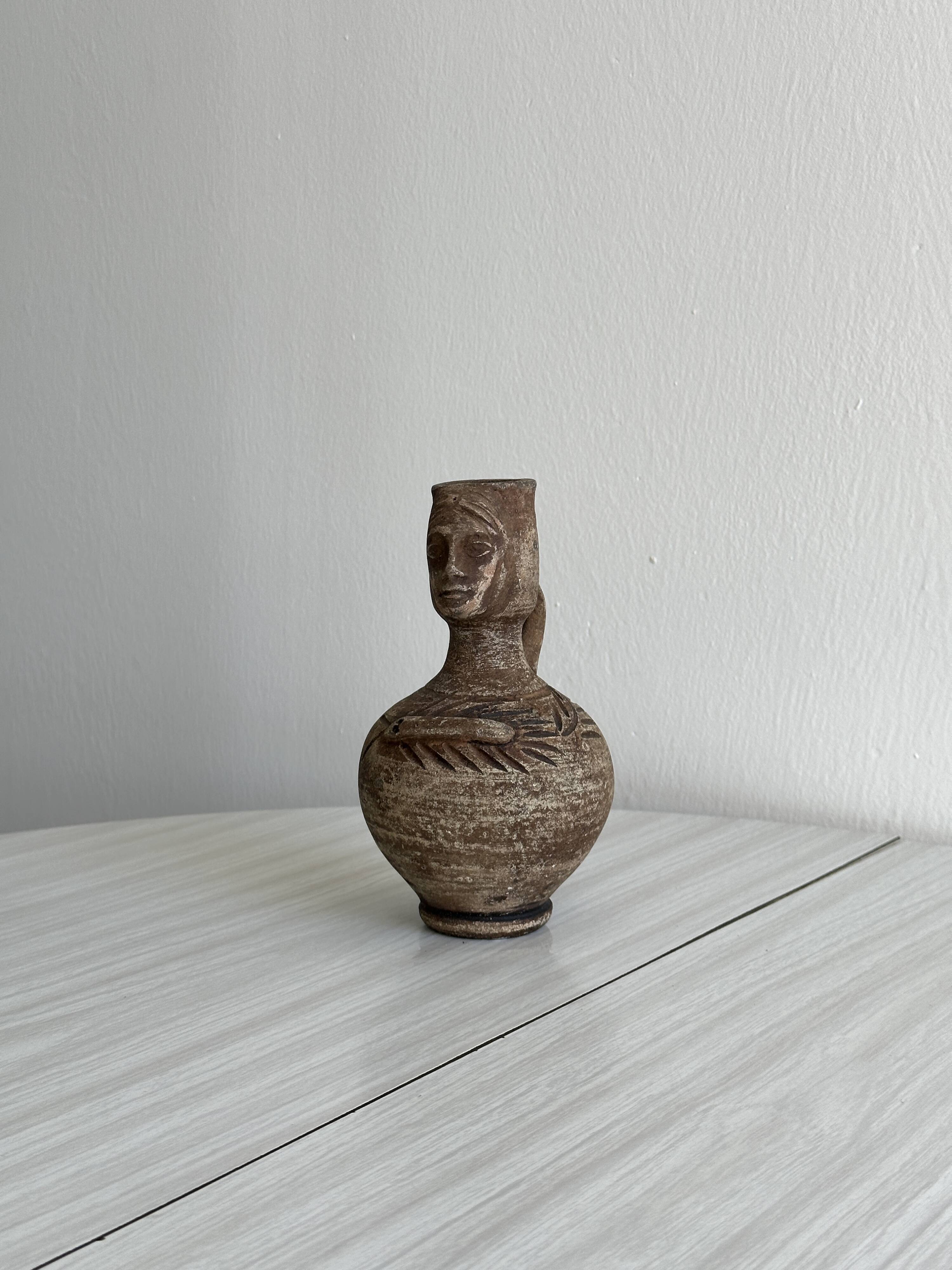 Decorative vase in raw terracotta