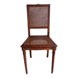 Chaise cannée art déco avec ornements en bronze.