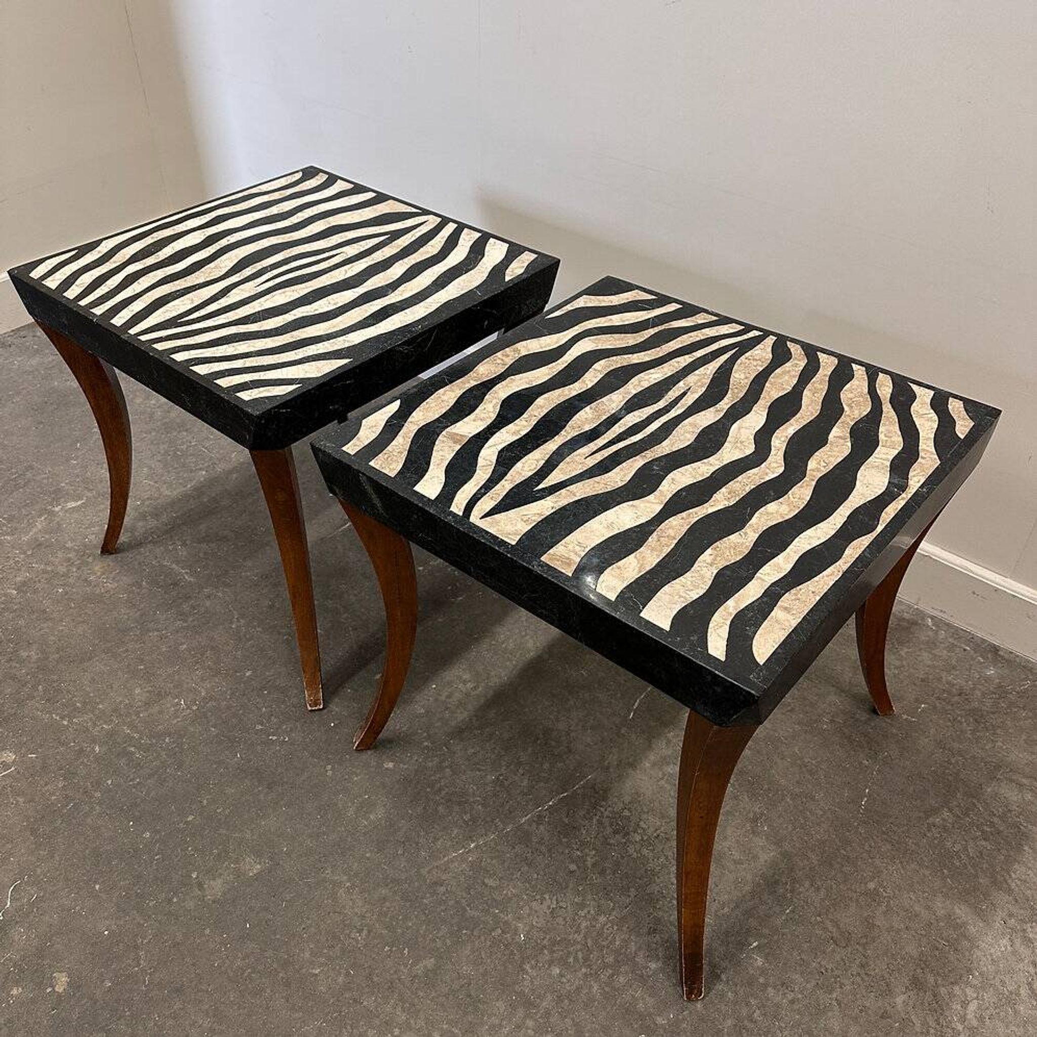 Striking pair of Italian zebra inlaid tessellated stone tables with refined curves