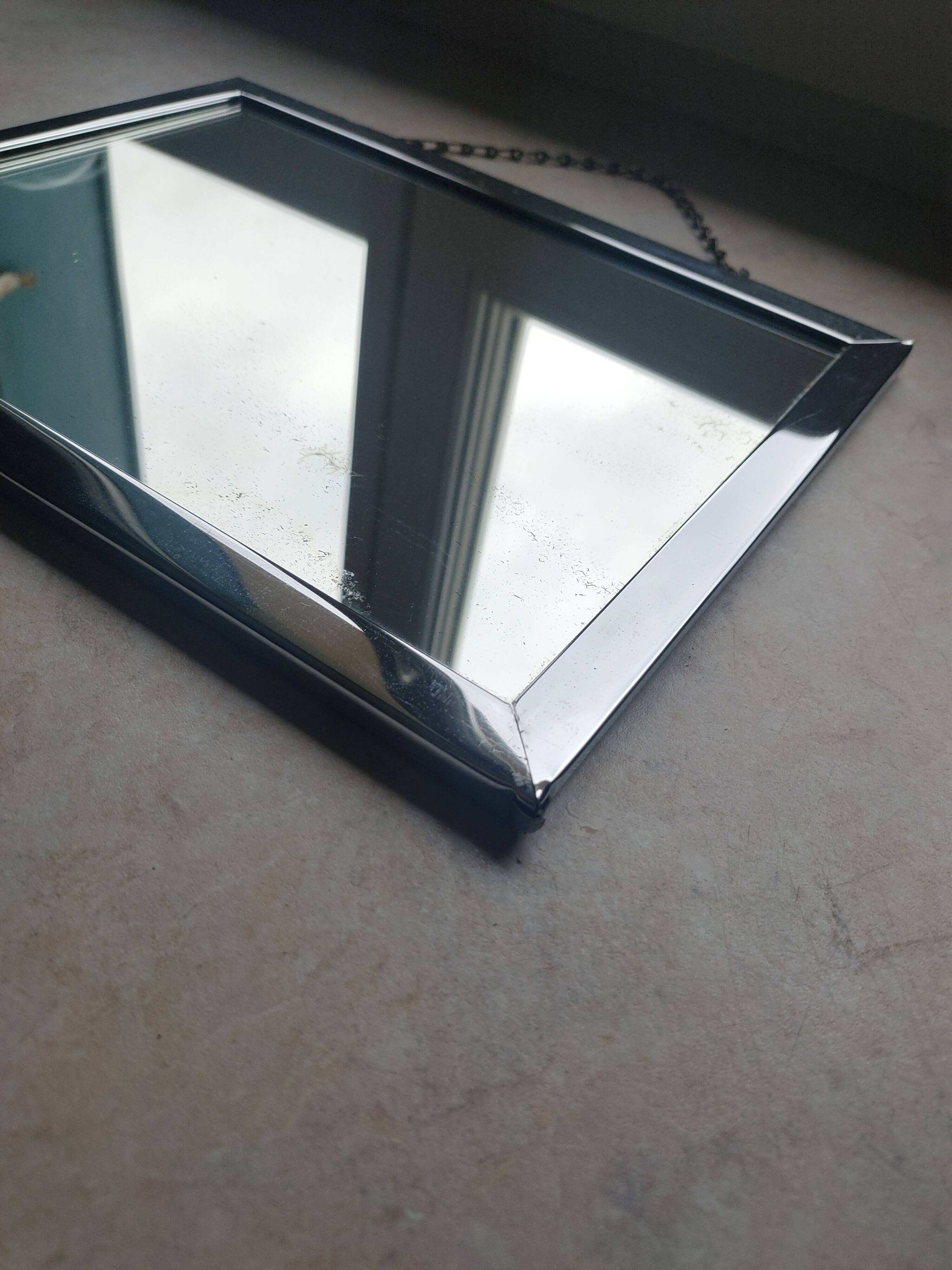 Barber mirror with chain.