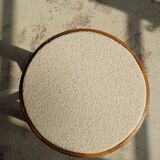 Mid-century Danish stool in oak, reupholstered in boucle wool, circa 1950.