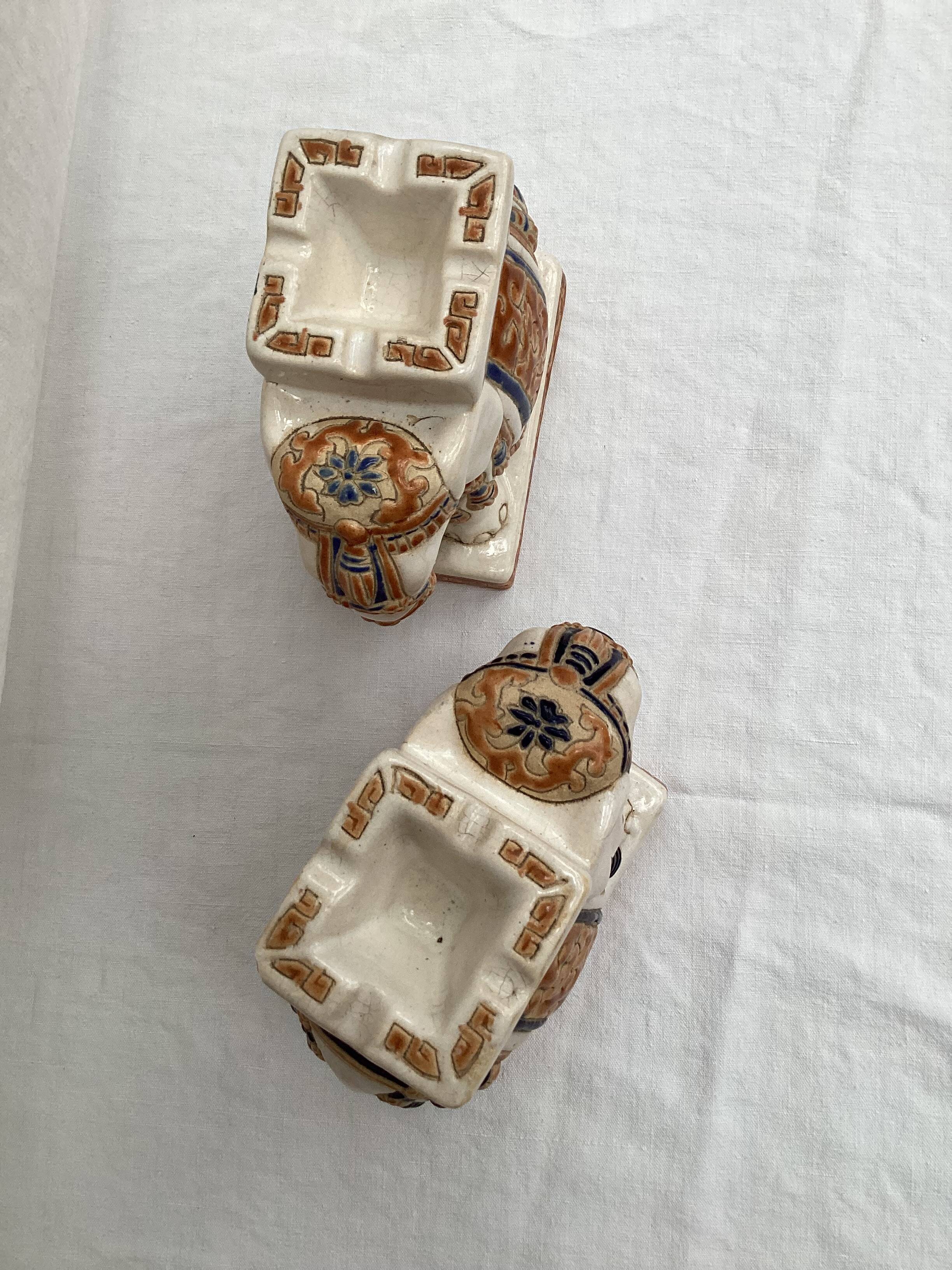 Pair of ceramic elephant ashtrays dimensions: height -14cm- width -13.5cm-