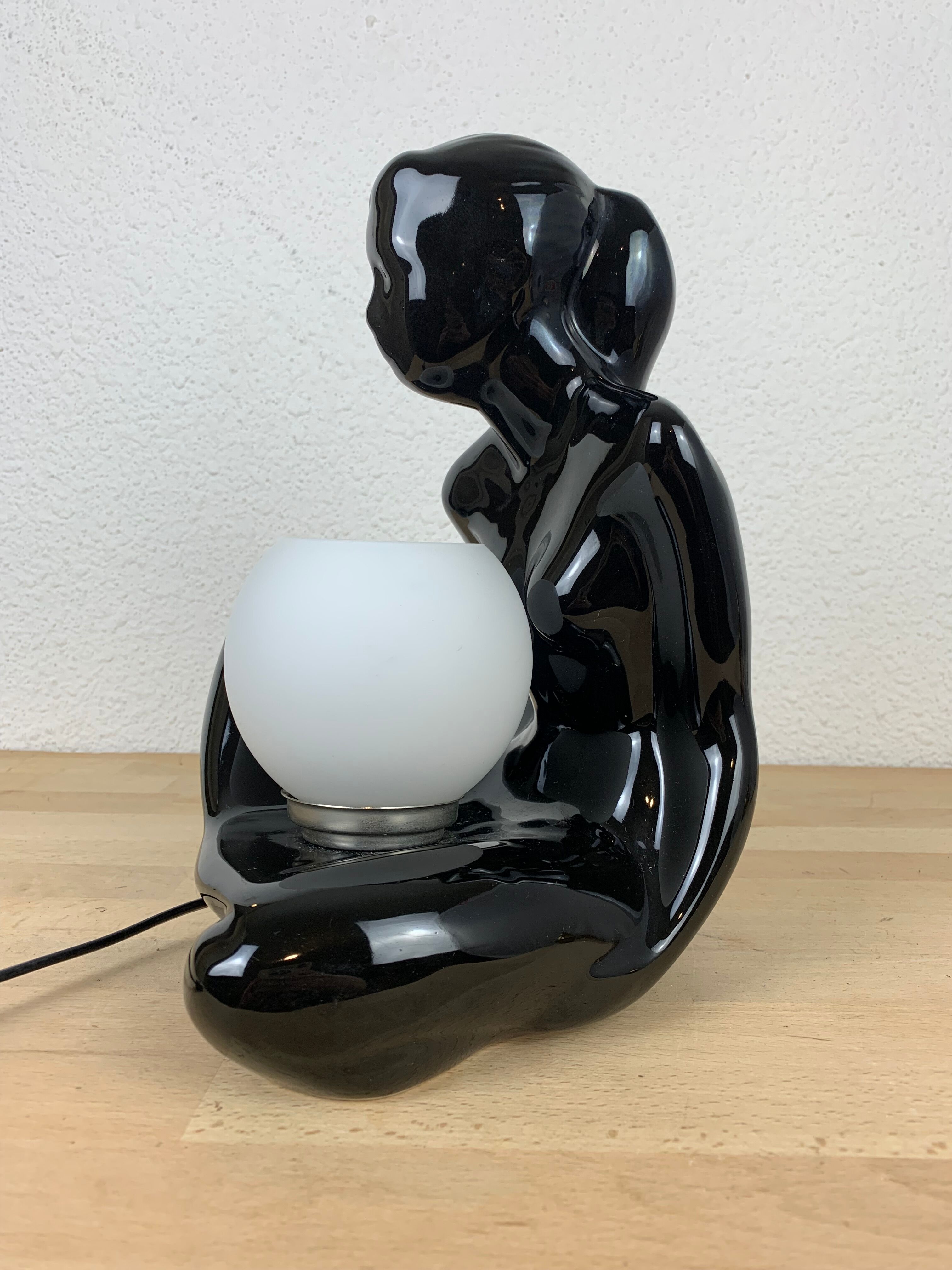 Black ceramic lamp and opal globe