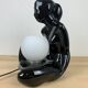 Black ceramic lamp and opal globe