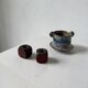 Pair of 1960s teak and brass "dice" candlesticks