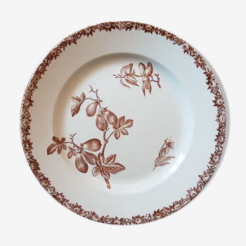 Old plate with decoration of flowers