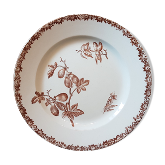 Assiette en faïence ancienne à décor de fleurs