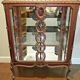 A Louis XV style display cabinet with three beechwood shelves and a white marble top.