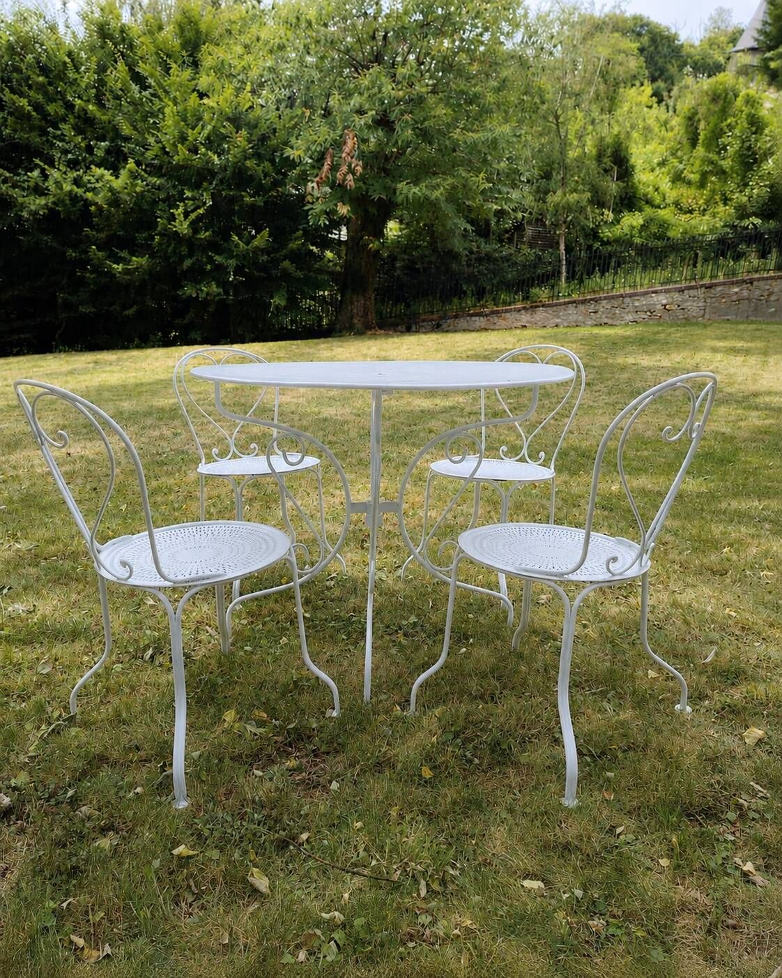 Renovated antique garden furniture in wrought iron, early 20th century.