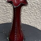 Burgundy red blown glass vase in the shape of a vintage corolla