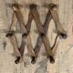 Extendable wooden wall-mounted coat rack
