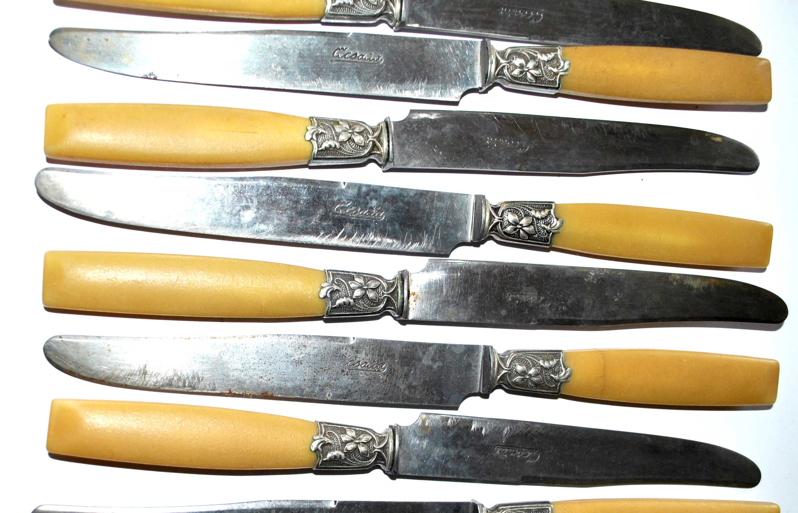 Series of 12 art nouveau knives in steel and beige bakelite 1900-1910