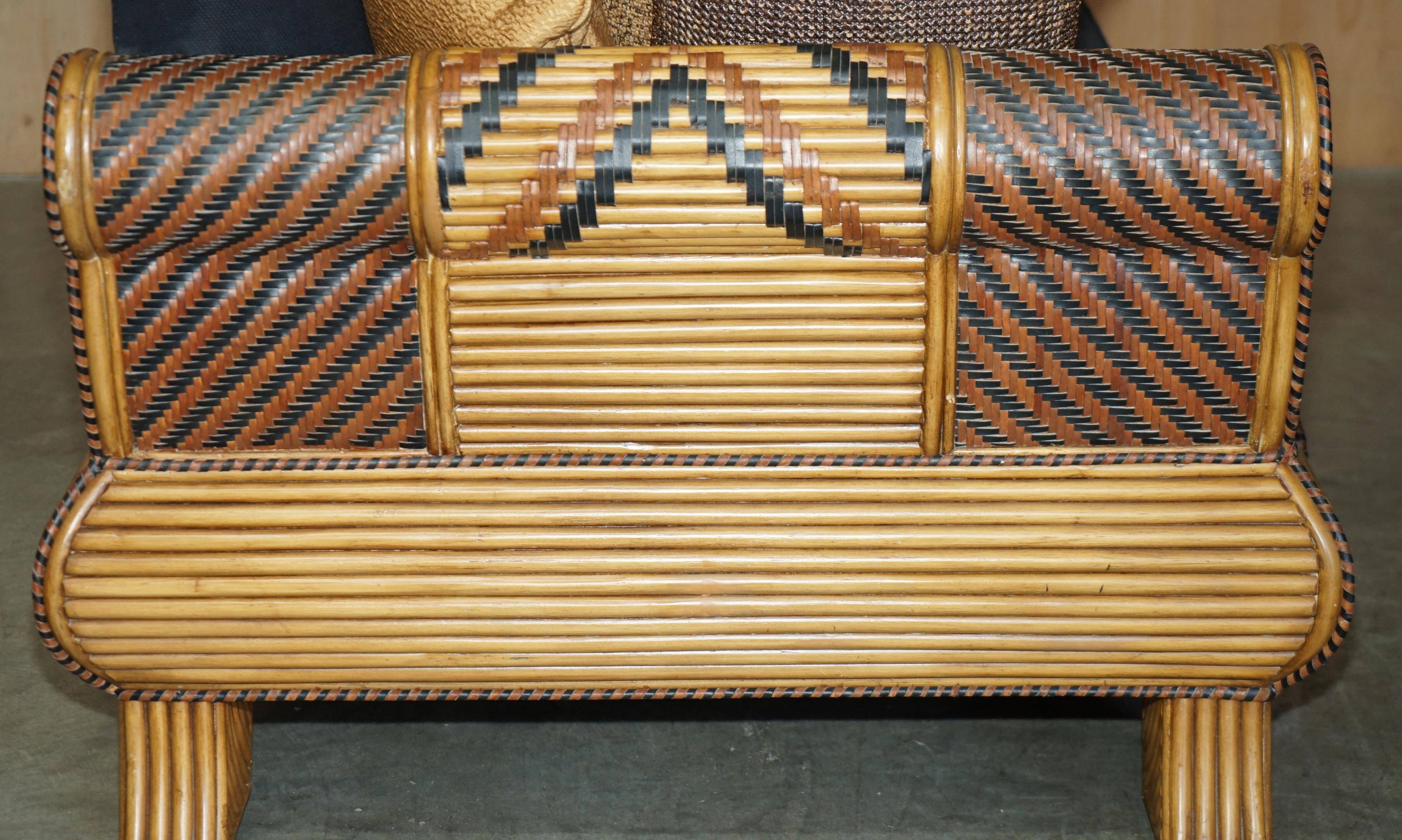 Vintage 1970s canapé with bamboo frame and Aztec patterns.