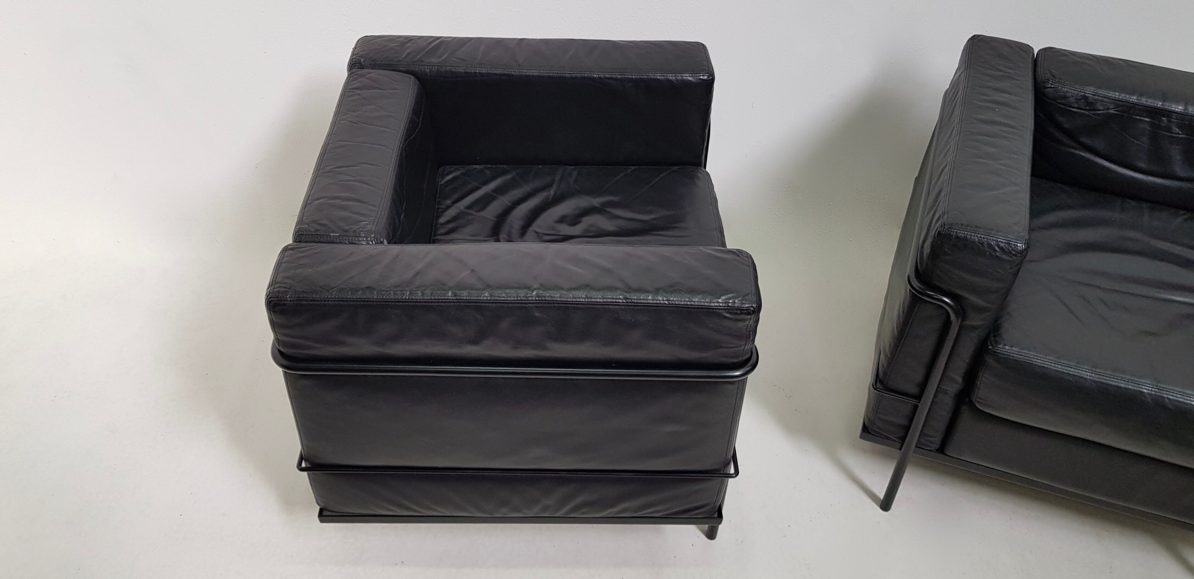 Pair of vintage armchairs Hugues Chevalier in leather 1980