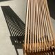 Foldable designer armchair in wooden slats