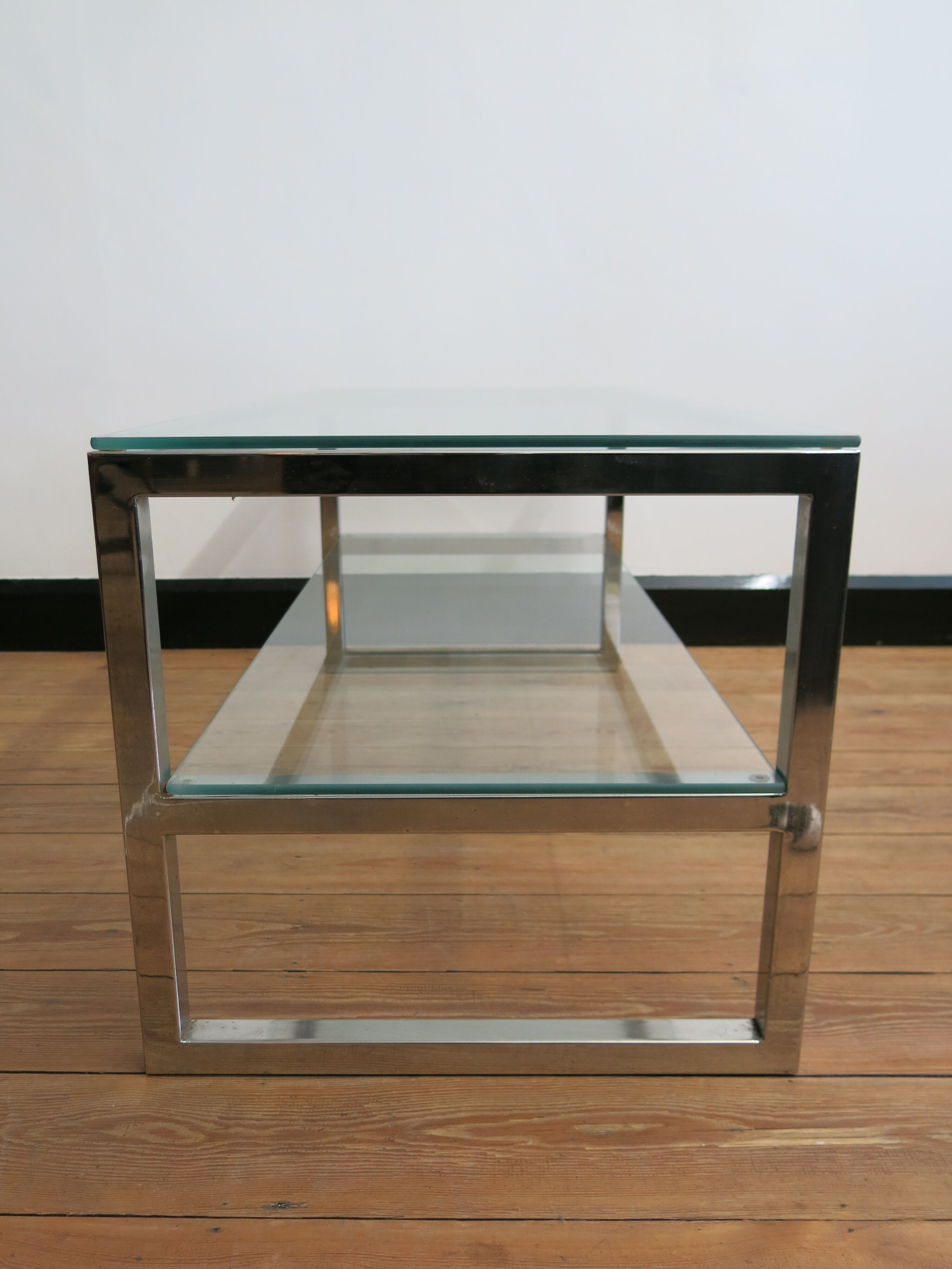 Coffee table in glass and chromed metal