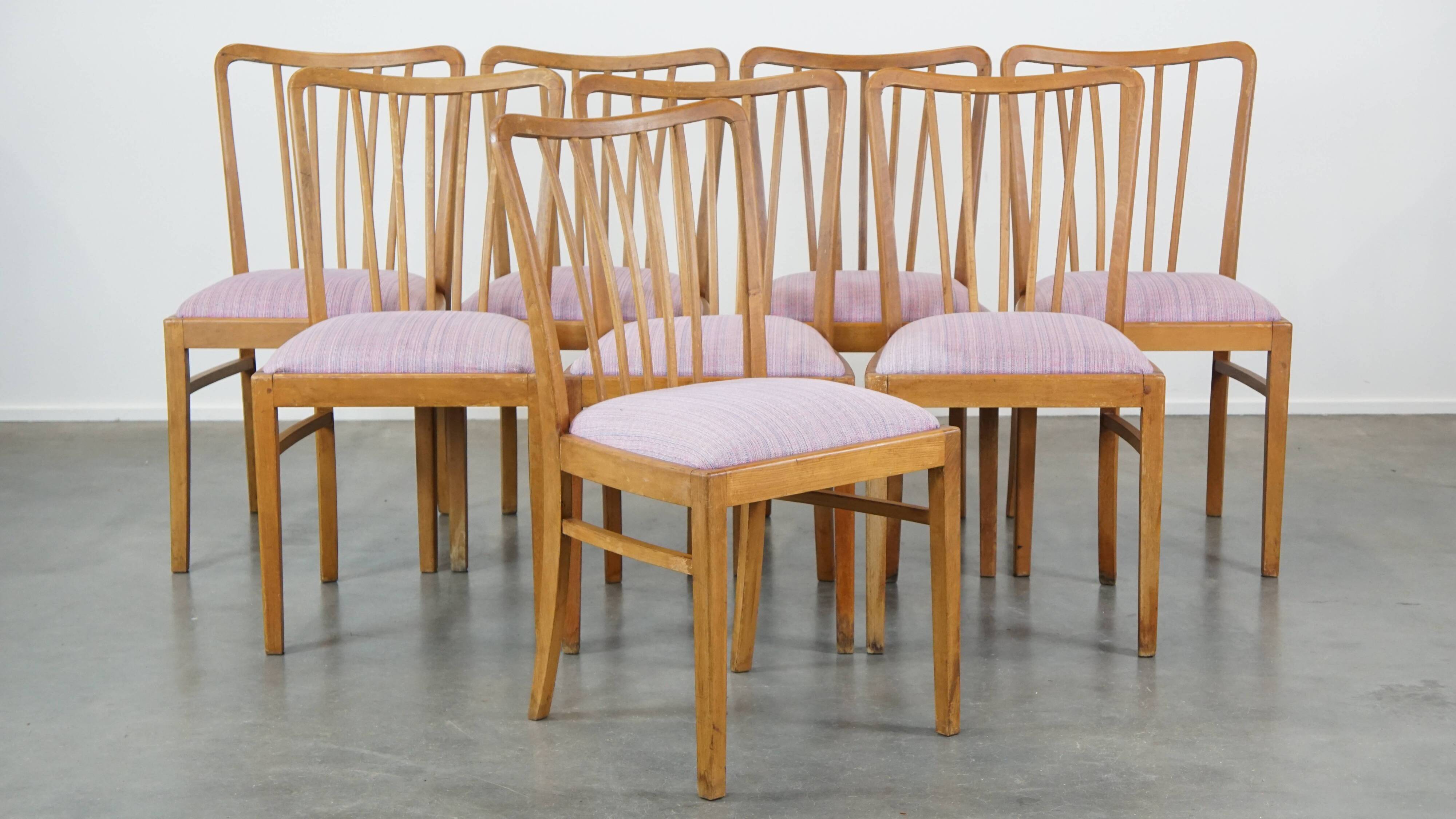 Set of 8 vintage Danish design dining chairs from the 1970s with light purple fabric seats