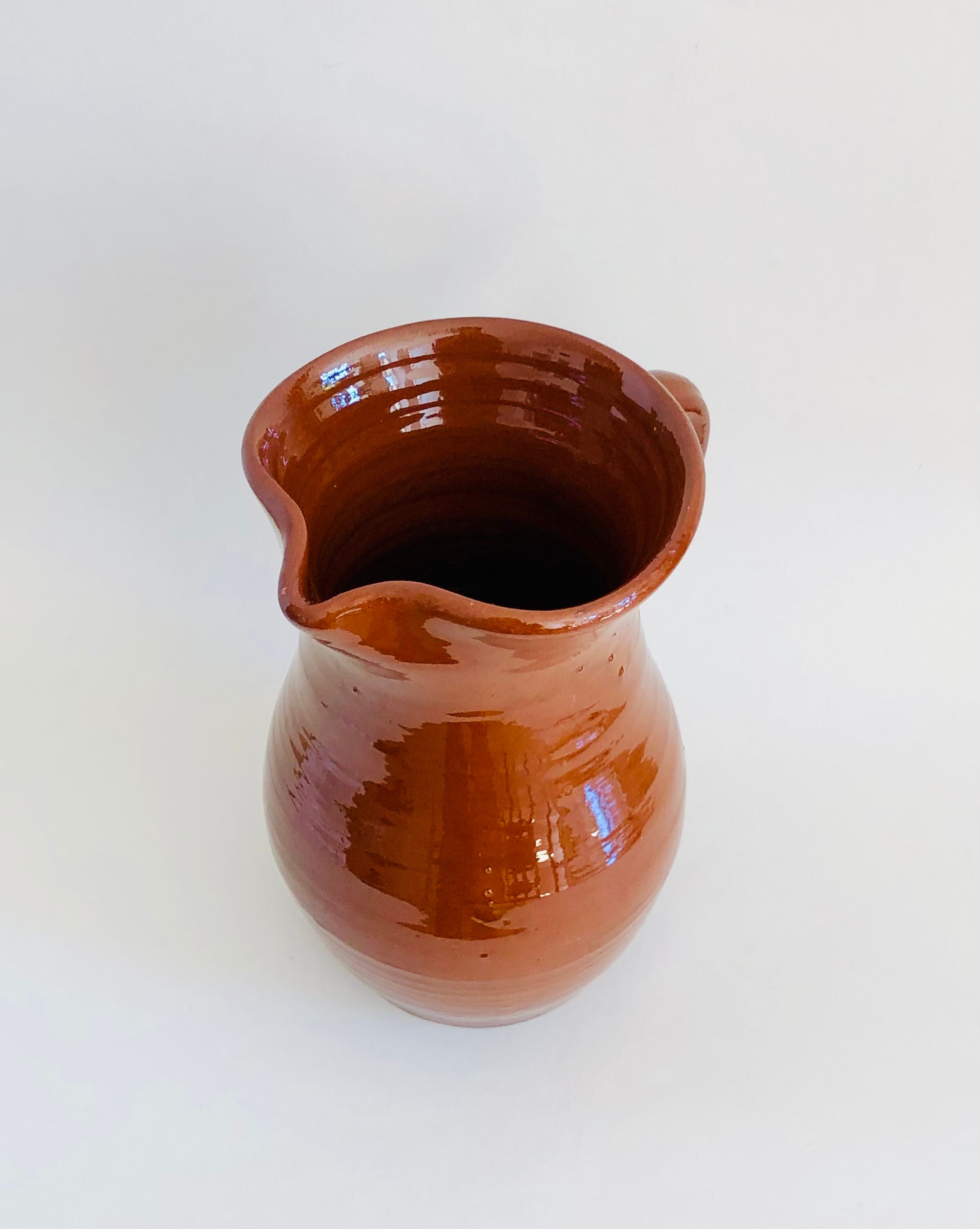 Vintage pitcher in glazed earth