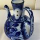 Glazed ceramic carafe with floral decoration