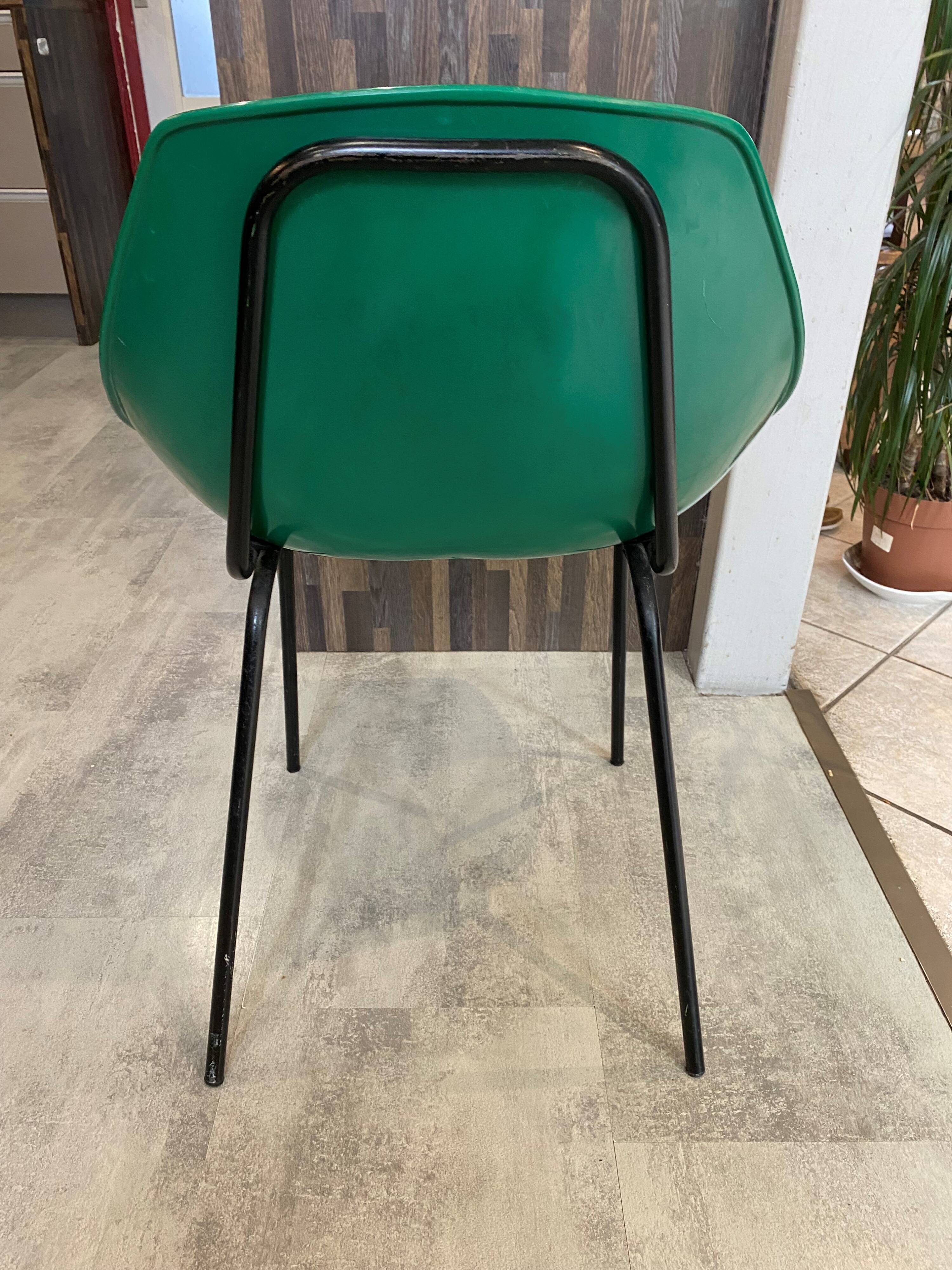 A shell chair by Pierre Guariche for Meurop in vintage green from the 1960s.