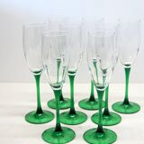 8 large green stem champagne flutes in very good condition.