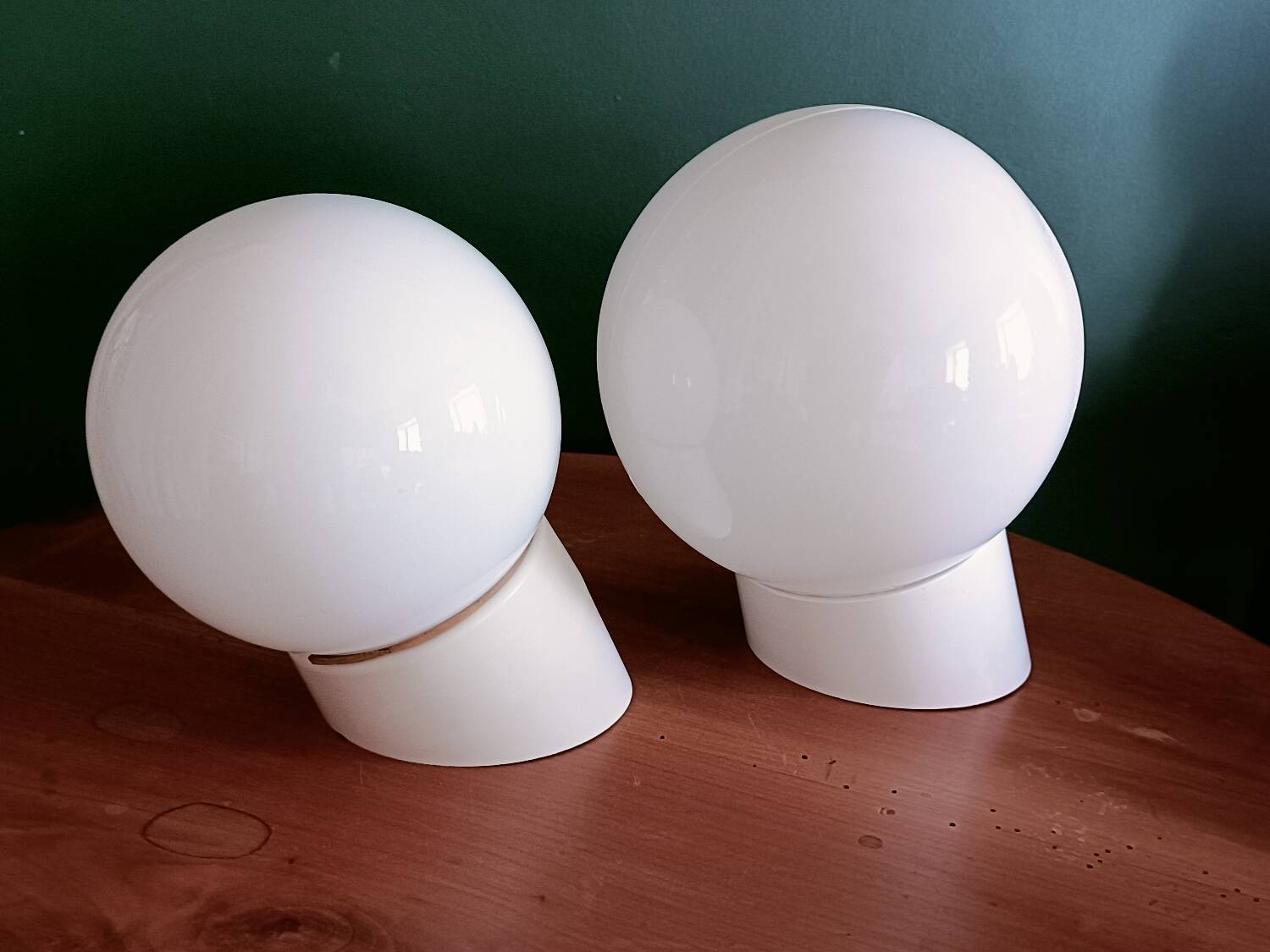 Two opaline glass globe wall lights